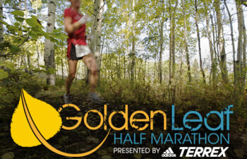 GoldenLeaf Half Marathon presented by Adidas Terrex - Runner in aspen tree forest with GoldenLeaf logo